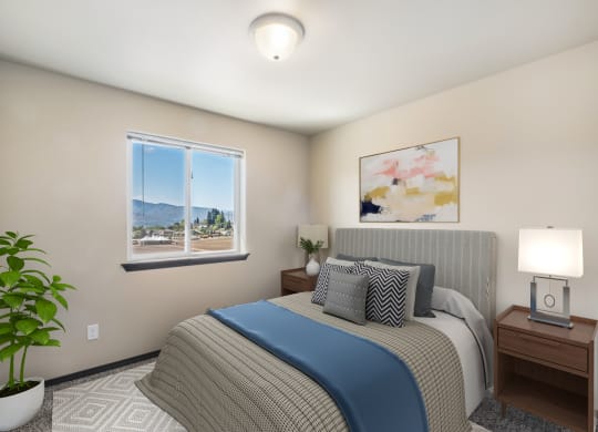 a bedroom with a large bed and two night stands with lamps  at Altitude, East Wenatchee, WA, 98802