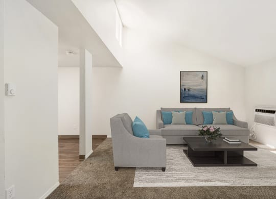 a living room with white walls and a brown rug at Park View Apartments, Wenatchee, WA
