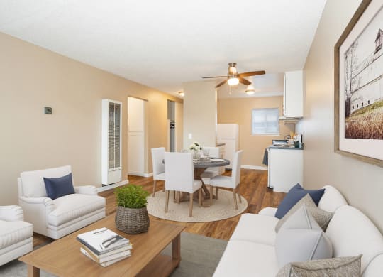 a living room and dining room with couches and a table