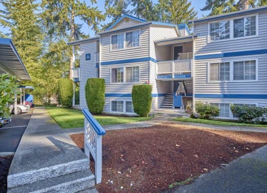 a blue and white house with a sidewalk in front of it  at Edmonds Gateway, Washington