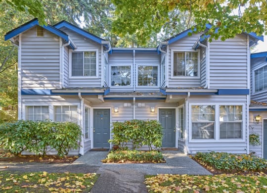 a blue and white house with a sidewalk in front of it at Edmonds Gateway, Edmonds, 98026