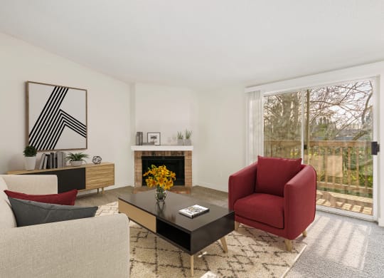 Spacious living room with taupe carpets, a fire place and mantle, and large sliding glass doors to a private balcony with nature views. at Pointe East, Fife, Washington