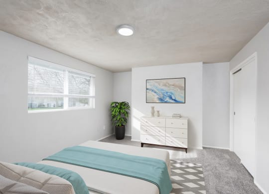 a bedroom with a bed and a dresser