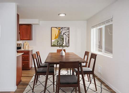 a kitchen and dining area with a carpeted floor and large window at Heritage Grove Apartments in Renton, WA