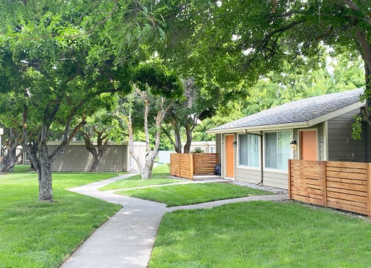a house with a sidewalk leading to the front door at Park View Apartments, Wenatchee