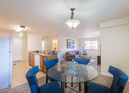 a living room with a glass table  and a kitchen  at Quail Springs, West Richland, Washington