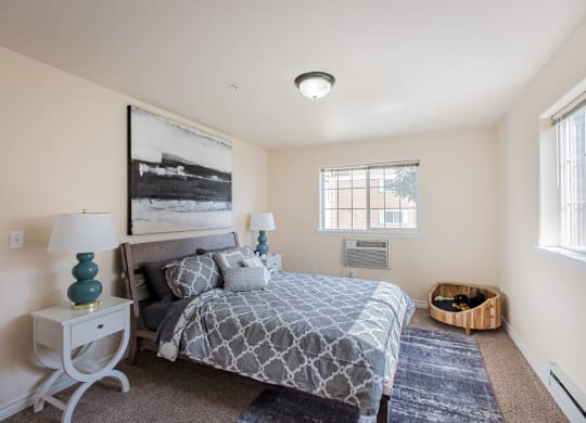 a bedroom with a bed and two windows  at Quail Springs, Washington