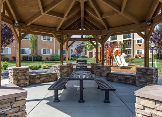 an open pavilion with benches and a picnic table  at Quail Springs, Washington, 99353