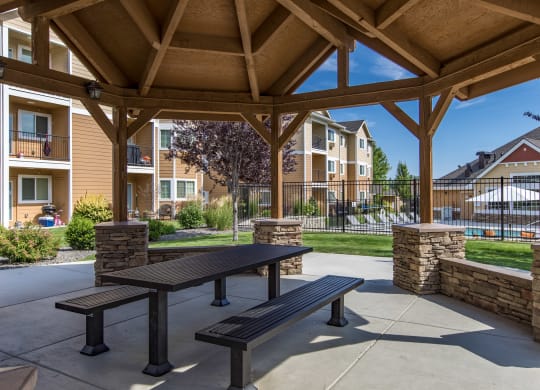 an outdoor patio with a pavilion in front of an apartment building  at Quail Springs, West Richland, 99353