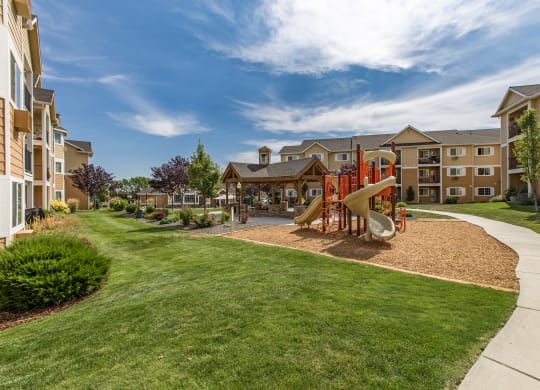 Exterior of Quail Springs grounds, green grass and playground