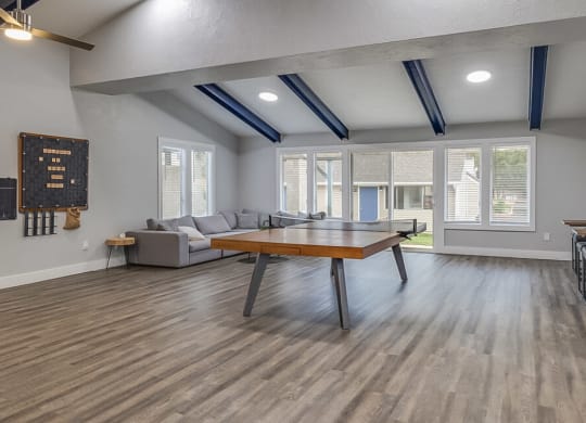 a living room with a ping pong table and a couch  at Kirkwood Meadows, Pocatello