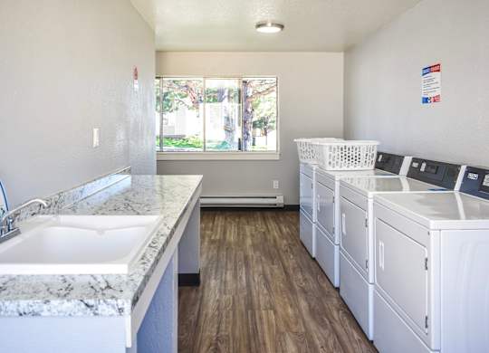 Community laundry room with washer and dryers at Kirkwood Meadows in Pocatello, ID