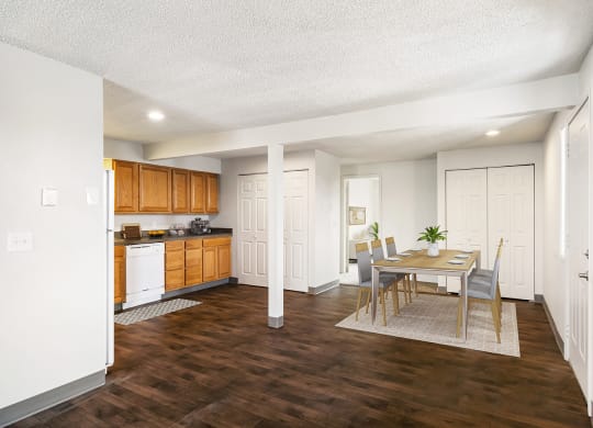 An open dining room and kitchen with a pantry to the left and a double-door closet to the right. Access to the hallway and bedrooms are behind.at Wildflower, Kennewick, WA