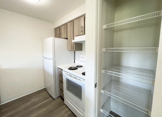 a small kitchen with a refrigerator and a stove and  at The Trail, Snohomish, WA, 98290