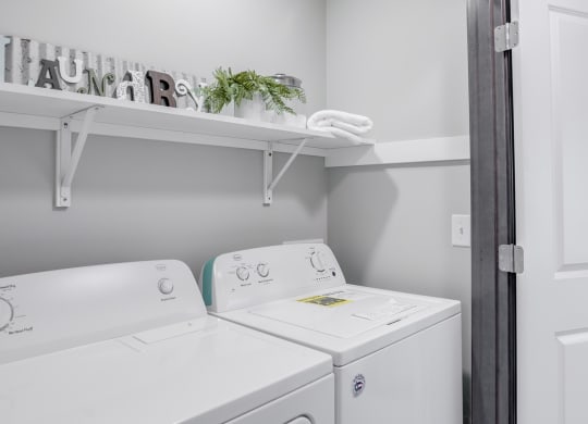 Closet with side by side full sized washer and dryer and upper storage. at Altitude, East Wenatchee, 98802