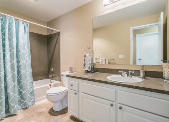 a bathroom with a sink toilet and a shower at Springfield, Renton, 98055 