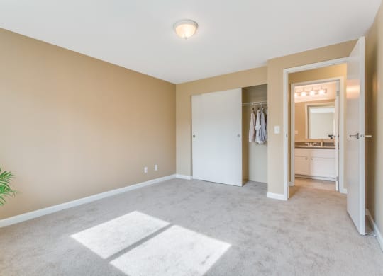 an empty living room with a closet and a bathroom at Springfield, Washington, 98055