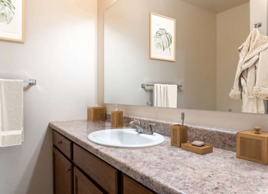 Bathroom with dark cabinets at Pine Tree Park, Kennewick