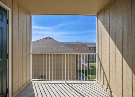 a balcony with a view of a house