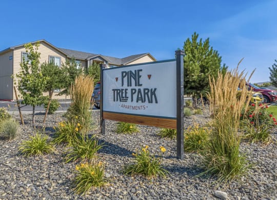 Pine Tree Park entrance with large sign and landscaping in Kennewick wa.