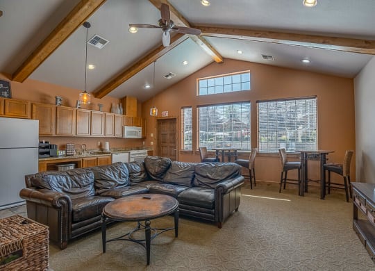 Quail Springs Apartments clubhouse. large couch and big windows