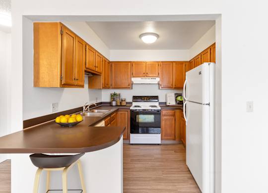a kitchen with a counter and a refrigerator at Rock Creek, Billings, 59102