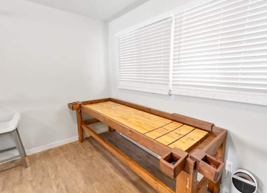 Resident lounge game area at Rock Creek Apartments in Billings, MT.