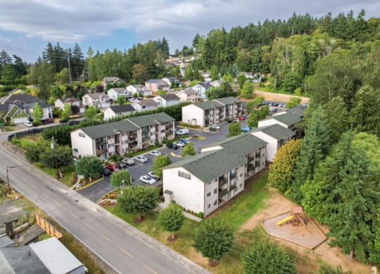 an aerial view of a neighborhood with houses and trees  at Sitka Heights, Fife, WA, 98424