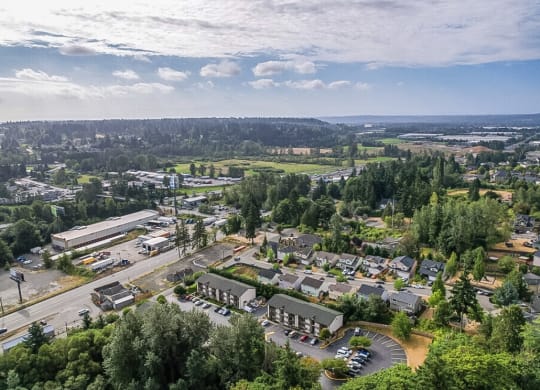an aerial view of a city with cars parked in a parking lot at Sitka Heights, Washington 