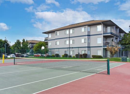a tennis court with a building in the background  at Shoreline Village, Richland, WA
