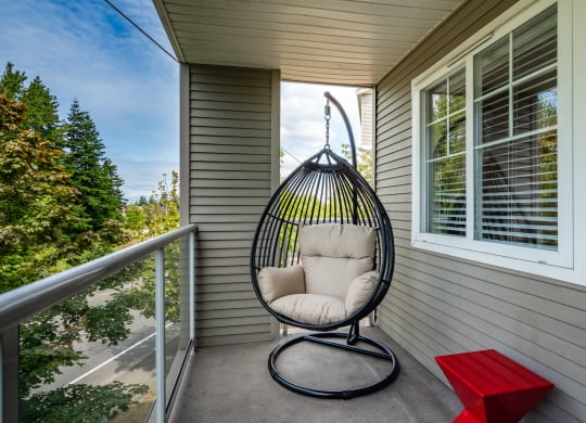 a swing chair on the porch of a home at Sky Vue, Washington, 98229
