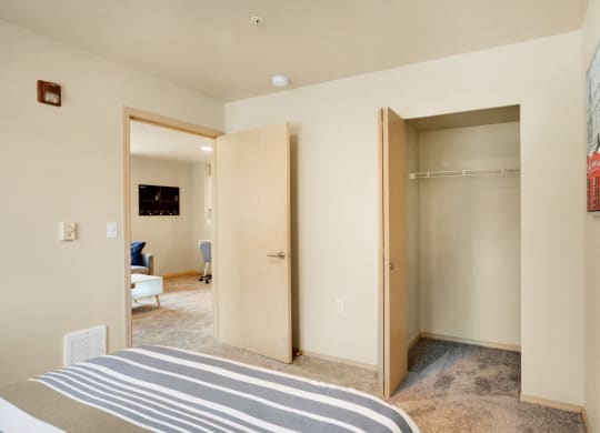 a bedroom with two closets and a bed and a carpeted floor at Sky Vue, Bellingham Washington