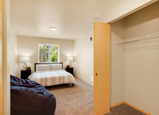 a bedroom with a bed and a closet at Sky Vue, Bellingham, WA