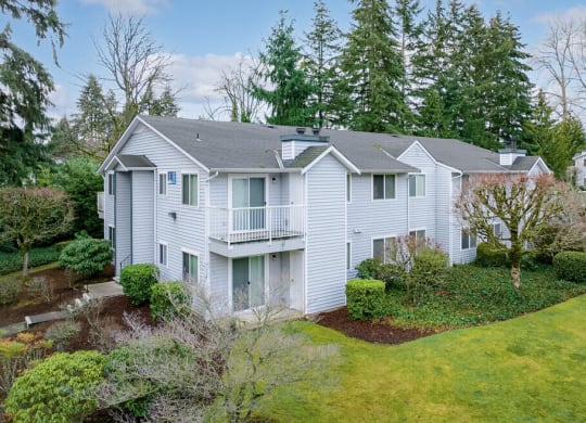 a white house with a yard and trees at Springfield, Washington, 98055 