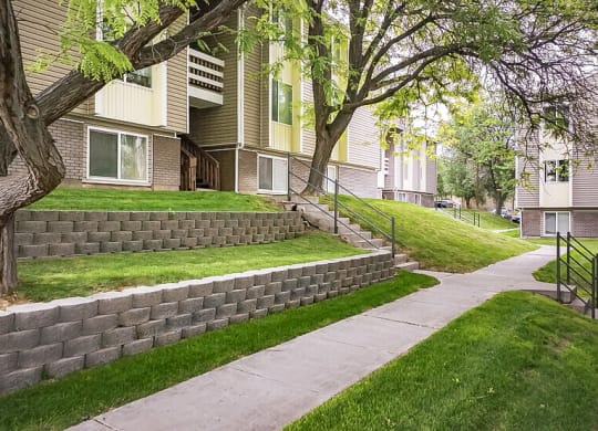 a sidewalk in front of a row of houses  at Summit, Pocatello, Idaho