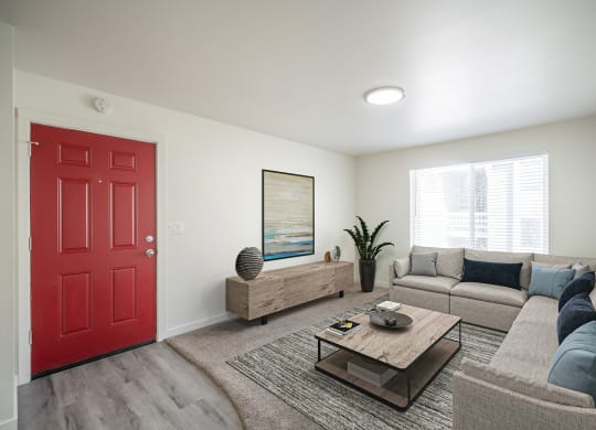 a living room with a red door at Summit, Pocatello
