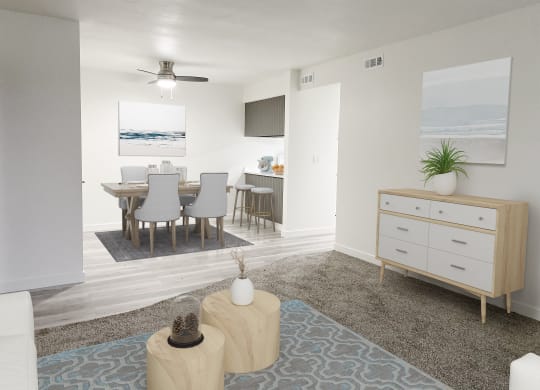 Living room opens into the dining area with a ceiling fan and breakfast bar on the right. Staged with dining set and wall art.at Summit, Idaho, 83201