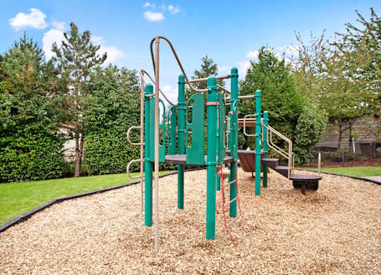 Green playground at Everett Apartments in WA at Sunrise Lane