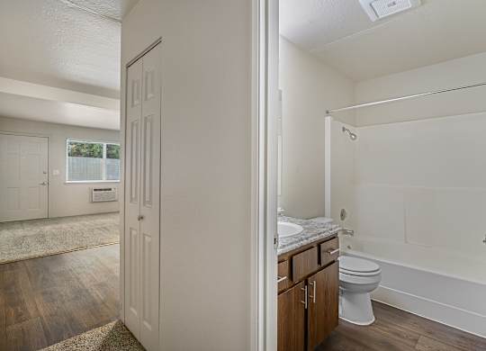 Open view of bathroom and living space inside a 500 square foot 1 bedroom apartment at The Lakes Apartments in Moses Lake WA