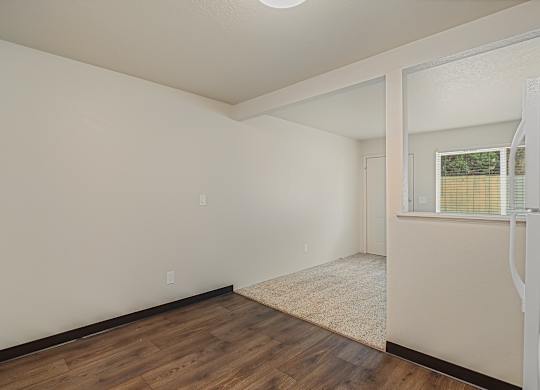 Open dining area and kitchen layout in a 1 bed 1 bath apartment at The Lakes Apartments in Moses Lake WA