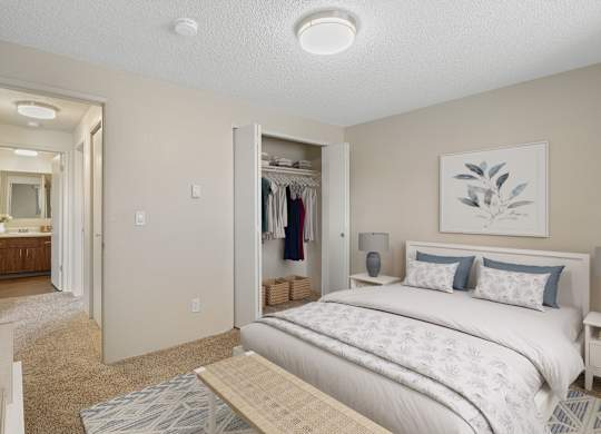 Bedroom with queen bed and built-in wardrobe at The Lakes Apartments 2 bed 1 bath layout in Moses Lake, WA