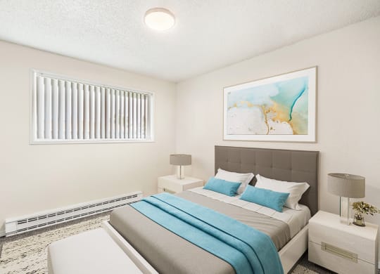 Spacious bedroom with white walls, taupe carpets, and a large window with white blinds. Staged with a bed, side tables, a bench, and art.at Wildflower, Washington, 99336