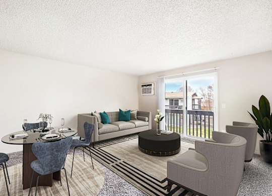 Living and dining area, sunny glass sliding doors with a view of grass lawn. Staged with a couch, 2 chairs, table, dining set and a plant.at Wildflower, Kennewick, 99336