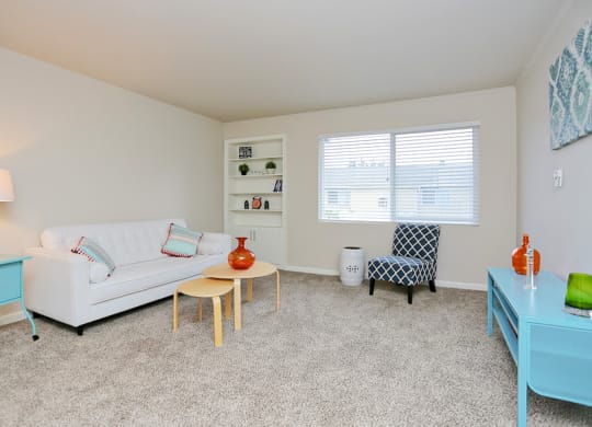 a living room with a couch and a table and a window  at Woodhaven, Everett, WA