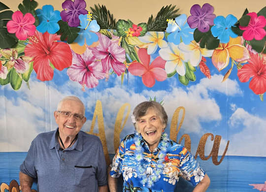 A man and a woman are standing at Lodi Commons Senior Living, California