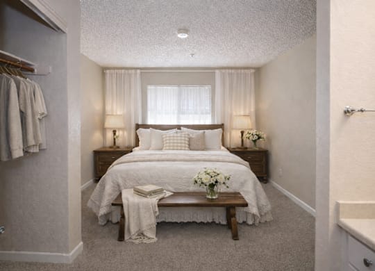 Bedroom with closet and adjoining bathroom at Roseville Commons Senior Living Apartments, California, 95678