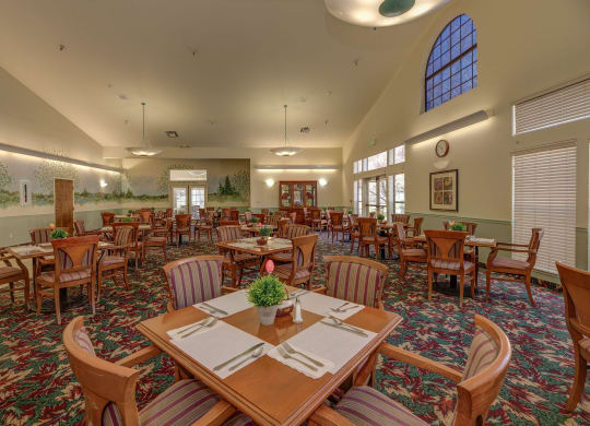a large dining room with tables and chairs at Hilltop Commons Senior Living, Grass Valley California