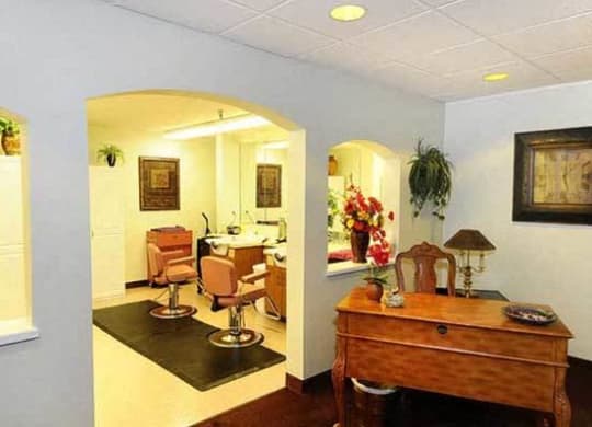 a living room and a dining room with a table and chairs at River Commons Senior Living, Redding, CA 96002