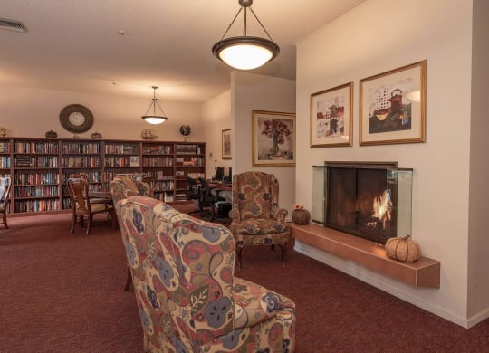 a living room with furniture and a fireplace at Roseville Commons Senior Living, Roseville, CA 95678 