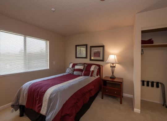 a bedroom with a bed and a window at Roseville Commons Senior Living, Roseville, CA 95678